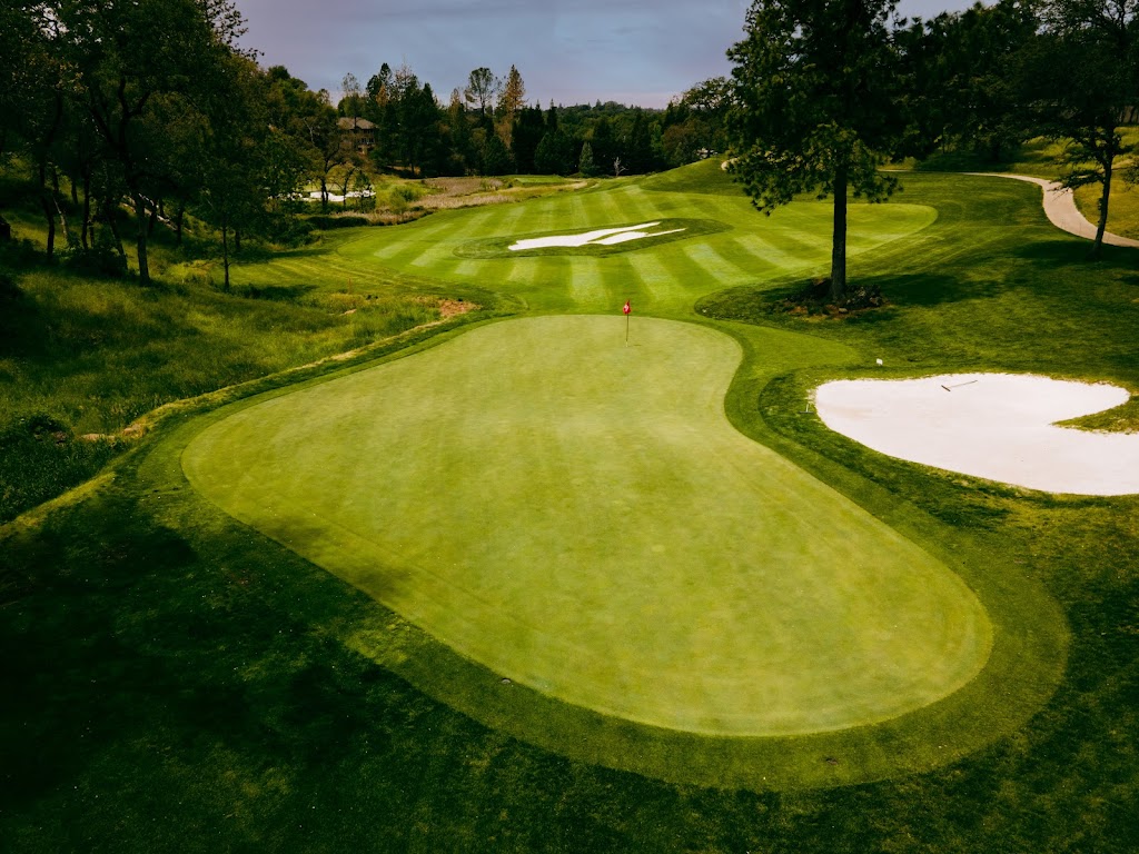 Panoramic view of a lush green golf course at Darkhorse Golf Course. Smooth