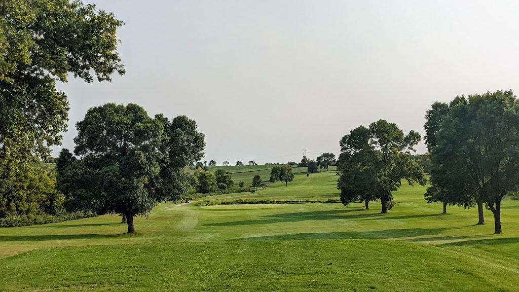 Panoramic view of a lush green golf course at Daytona Golf Club. Smooth