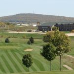 Panoramic view of a lush green golf course at Deer Valley Golf Course. Smooth