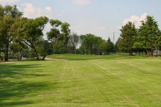 Panoramic view of a lush green golf course at Derby Golf & Country Club. Smooth