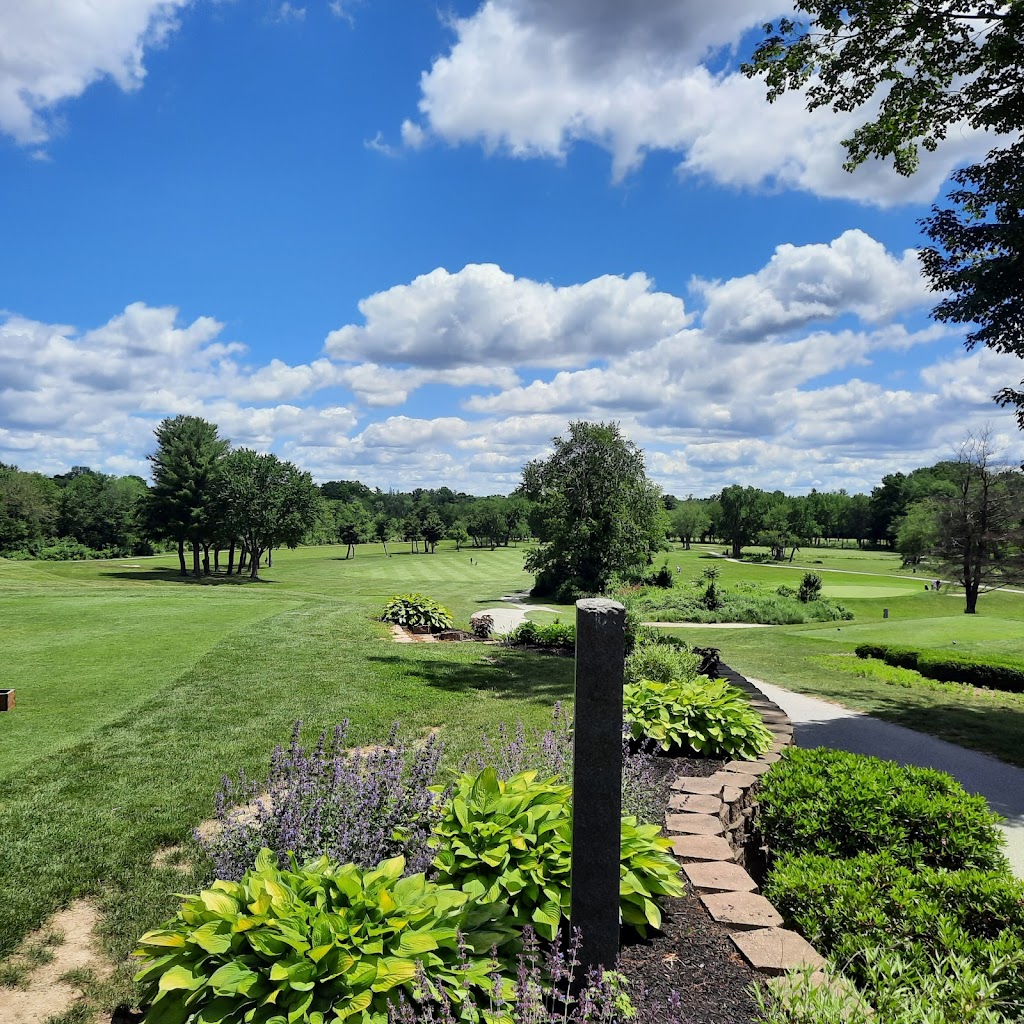 Panoramic view of a lush green golf course at Derryfield Country Club. Smooth