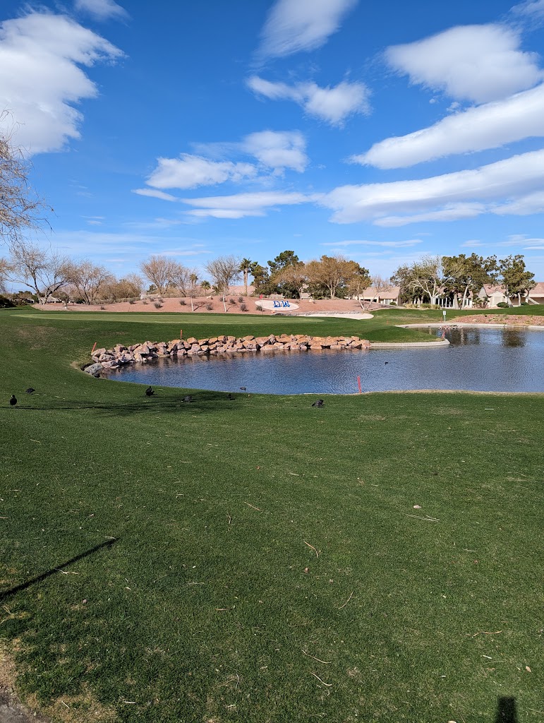 Panoramic view of a lush green golf course at Desert Willow Golf Course. Smooth