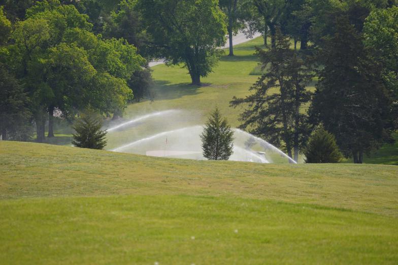 Panoramic view of a lush green golf course at Diamond Hills Country Club & Bunker Grill. Smooth