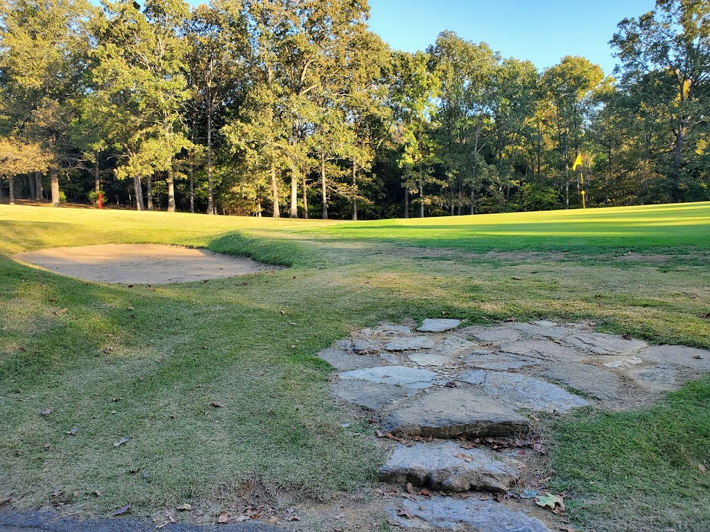 Panoramic view of a lush green golf course at Doe Valley Golf Club. Smooth