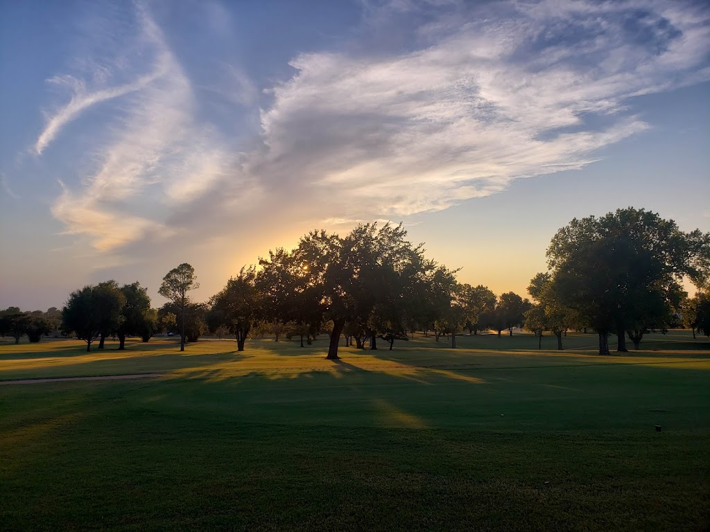 Panoramic view of a lush green golf course at Duncan Golf & Tennis Club. Smooth