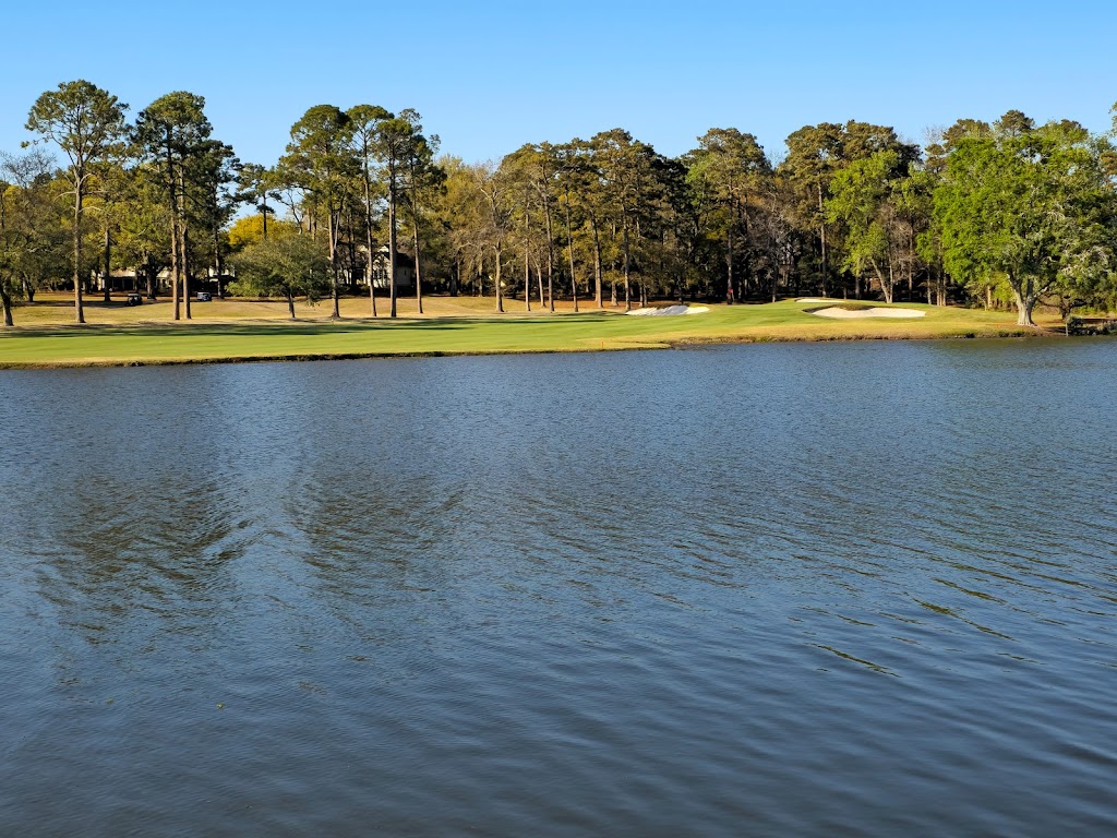 Panoramic view of a lush green golf course at Dunes Golf and Beach Club. Smooth