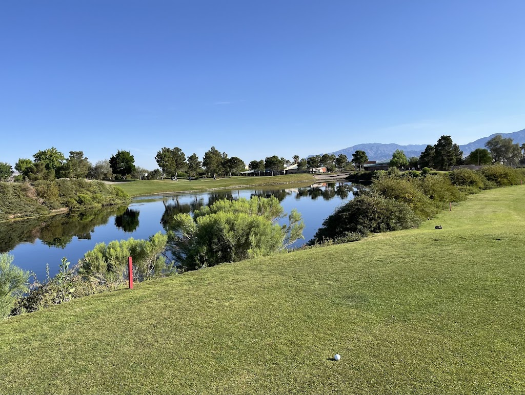 Panoramic view of a lush green golf course at Durango Hills Golf Club. Smooth