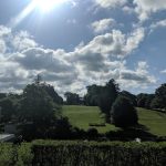 Panoramic view of a lush green golf course at E. Gaynor Brennan Golf Course. Smooth