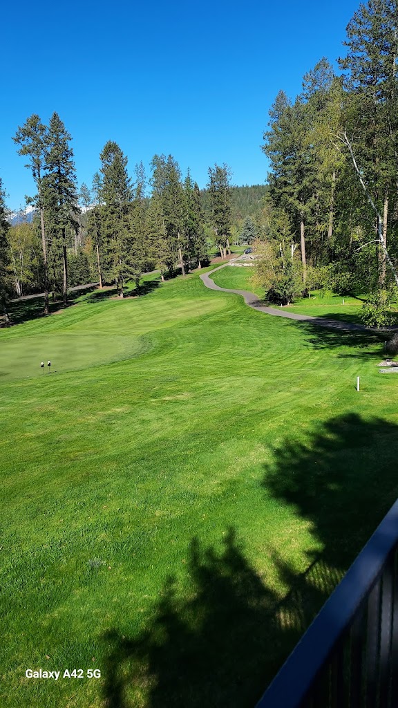 Panoramic view of a lush green golf course at Eagle Bend Golf Club. Smooth