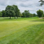 Panoramic view of a lush green golf course at Eagle Creek Golf Club - Norwalk