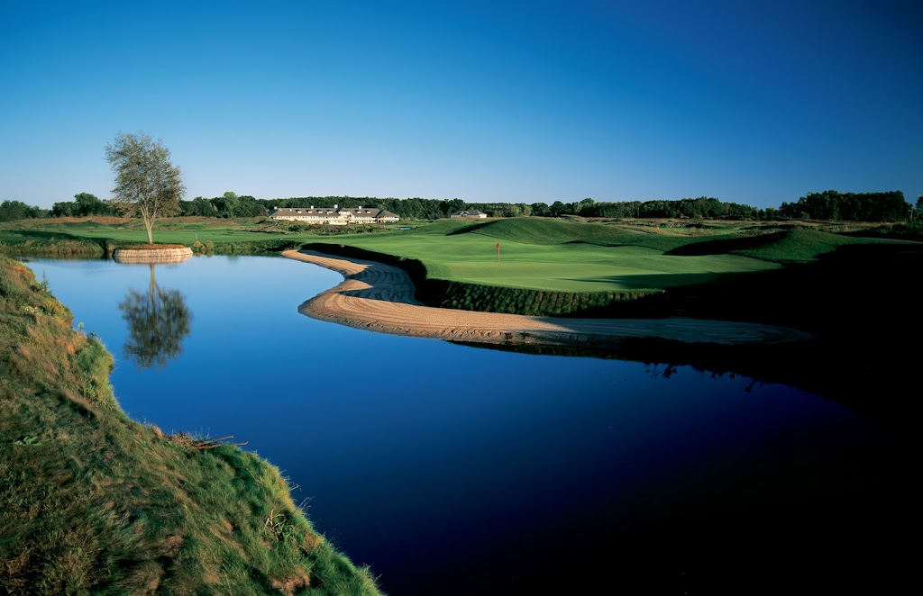 Panoramic view of a lush green golf course at Eagle Eye Golf Club. Smooth