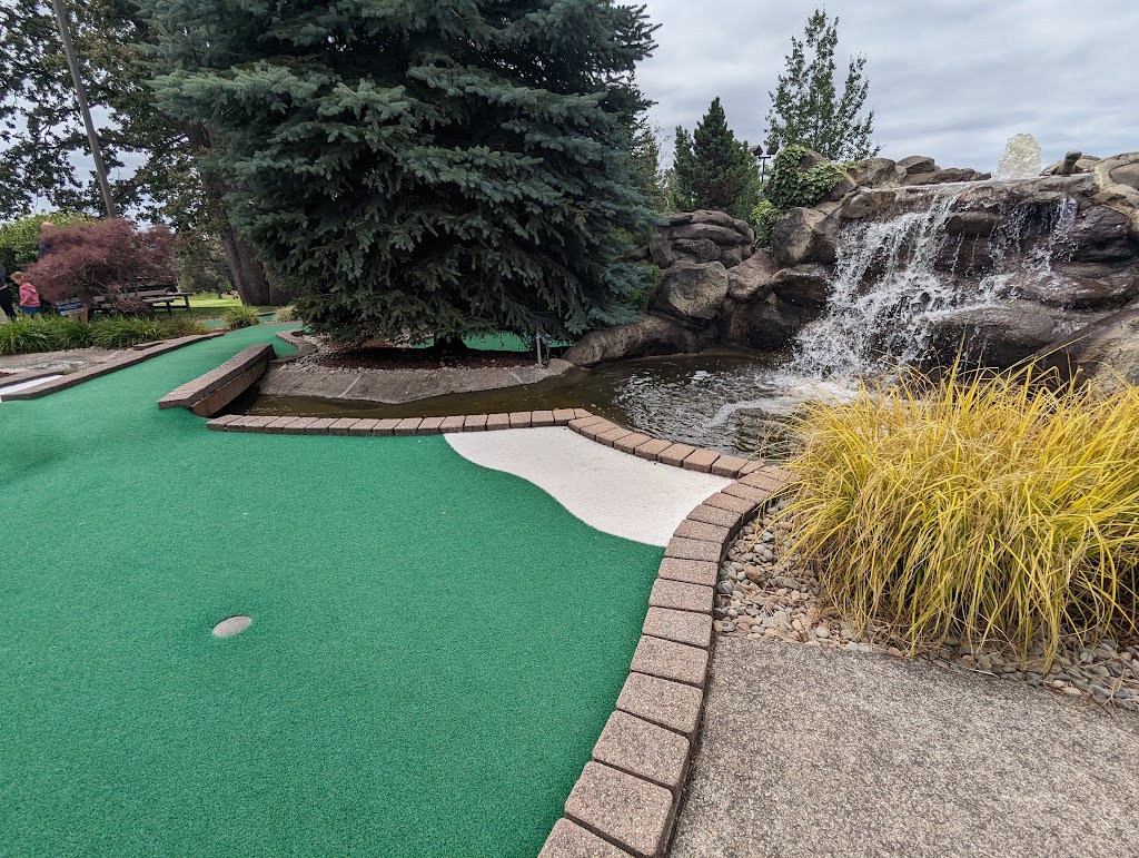 Panoramic view of a lush green golf course at Eagle Landing Golf Course. Smooth