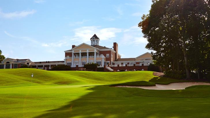 Panoramic view of a lush green golf course at Eagles Landing Country Club. Smooth