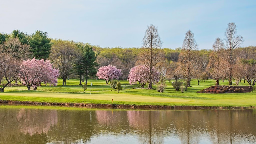 Panoramic view of a lush green golf course at Eagle's Nest Country Club. Smooth