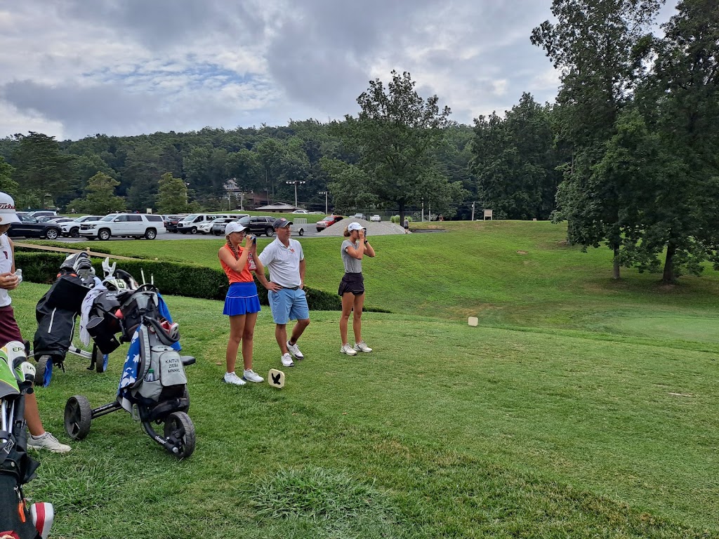 Panoramic view of a lush green golf course at Eagle's Nest Country Club. Smooth