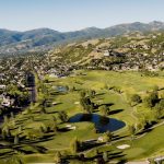 Panoramic view of a lush green golf course at Eaglewood Golf Course and Grill. Smooth