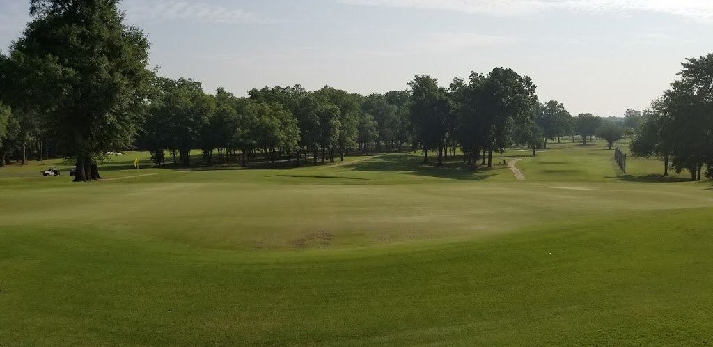 Panoramic view of a lush green golf course at East Ridge Country Club. Smooth