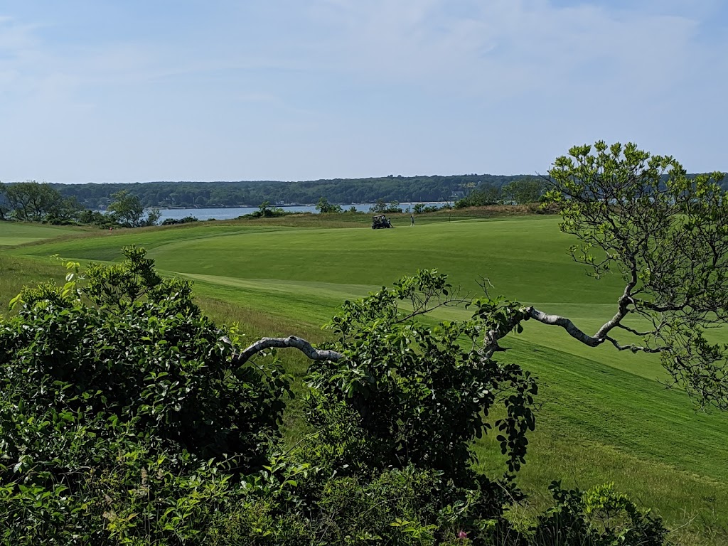 Panoramic view of a lush green golf course at Eastward Ho!. Smooth