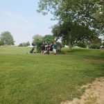 Panoramic view of a lush green golf course at Echo City Golf Course. Smooth