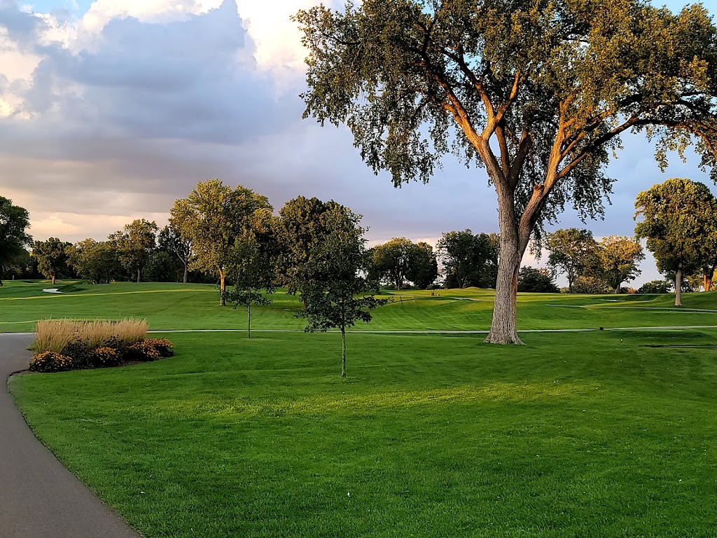 Panoramic view of a lush green golf course at Edina Country Club. Smooth