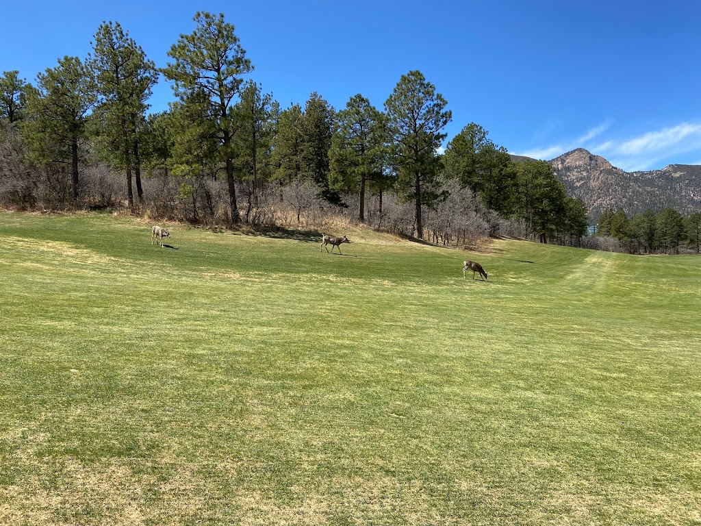 Panoramic view of a lush green golf course at Eisenhower Golf Course. Smooth