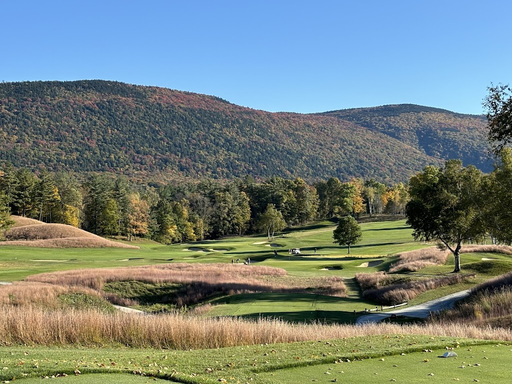 Panoramic view of a lush green golf course at Ekwanok Country Club. Smooth