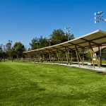 Panoramic view of a lush green golf course at El Cariso Golf Course. Smooth