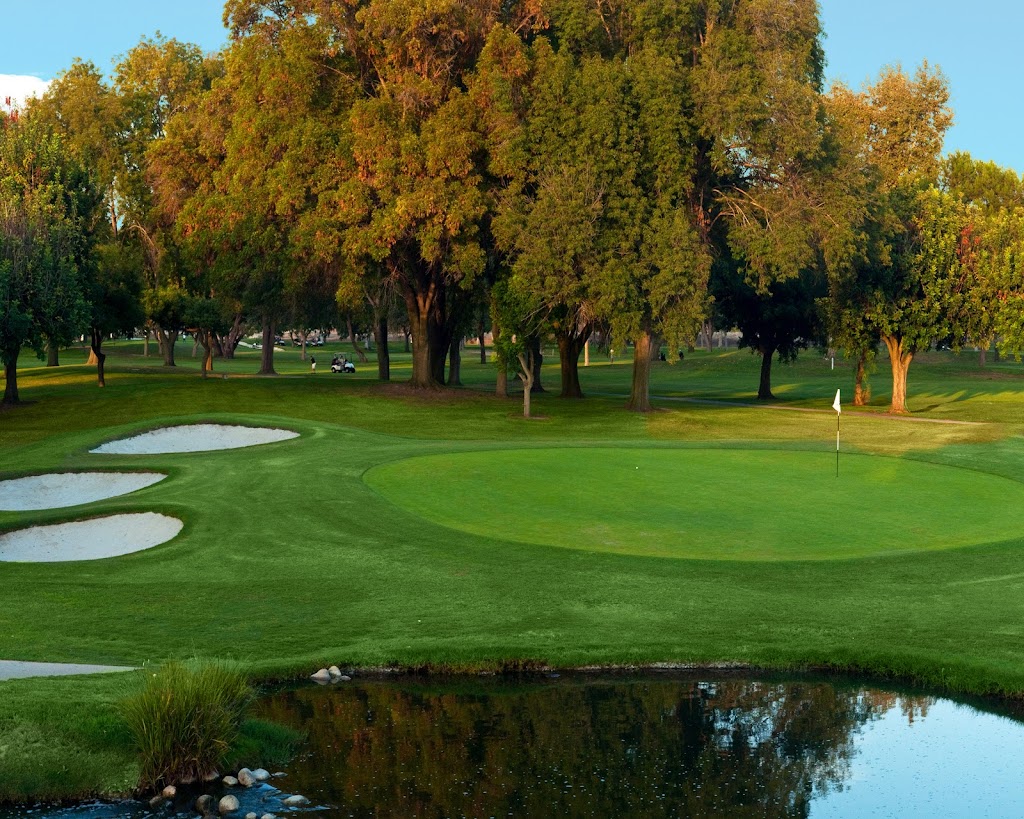 Panoramic view of a lush green golf course at El Dorado Park Golf Course. Smooth