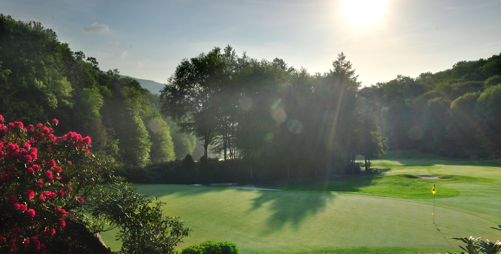 Panoramic view of a lush green golf course at Elk River Club. Smooth