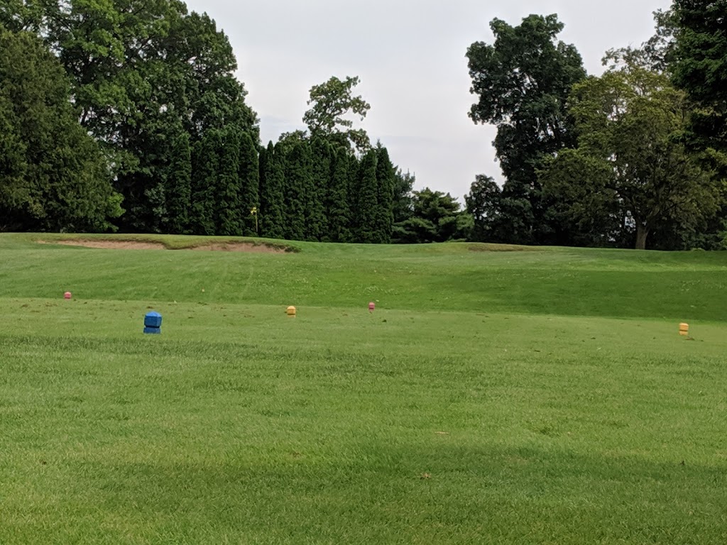 Panoramic view of a lush green golf course at Ella Sharp Park Golf Course. Smooth