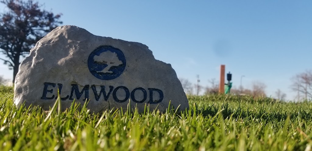 Panoramic view of a lush green golf course at Elmwood Golf Course. Smooth