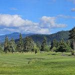 Panoramic view of a lush green golf course at Emerald Valley Golf Club. Smooth