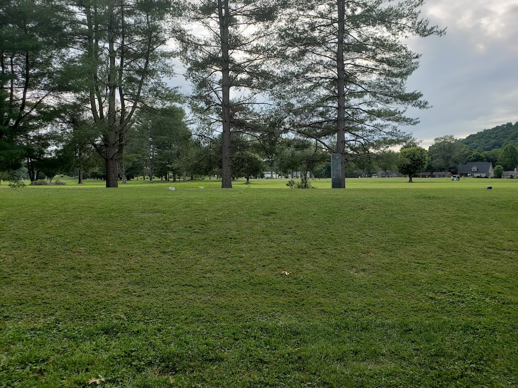 Panoramic view of a lush green golf course at Esquire Golf Course. Smooth