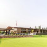 Panoramic view of a lush green golf course at Eugene Country Club. Smooth