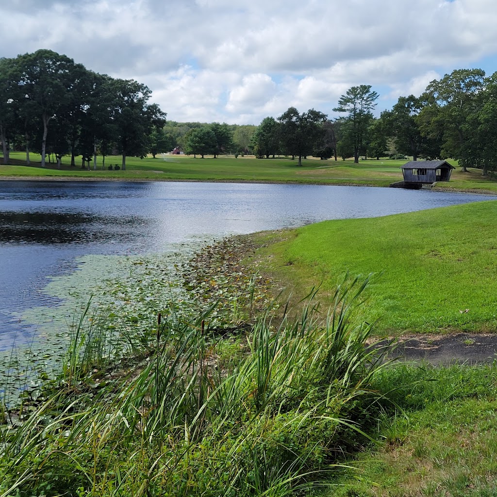 Panoramic view of a lush green golf course at Exeter Country Club. Smooth