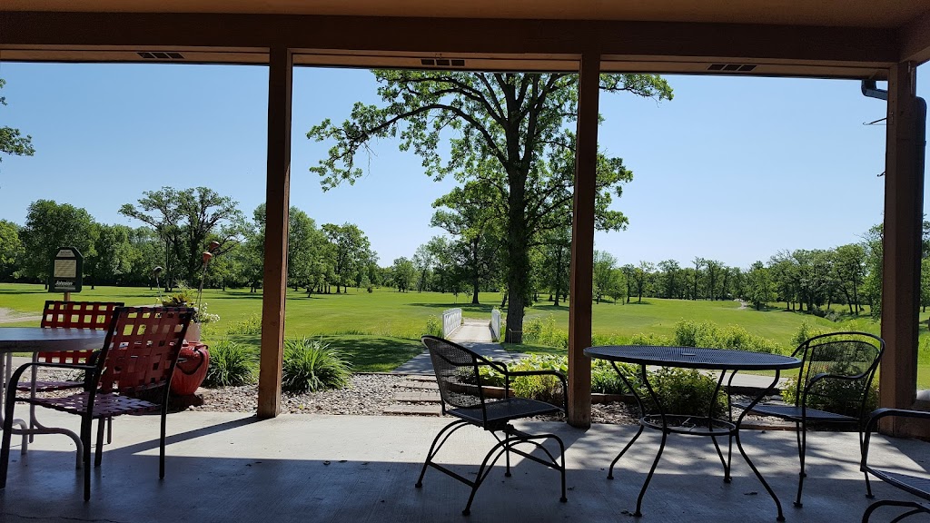 Panoramic view of a lush green golf course at Fair Oaks Golf Course. Smooth