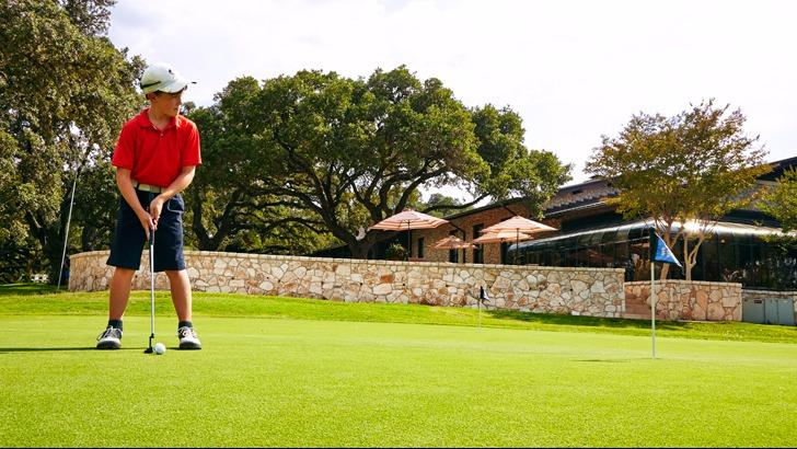 Panoramic view of a lush green golf course at Fair Oaks Ranch Golf & Country Club. Smooth