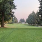 Panoramic view of a lush green golf course at Fairway Village Golf Course. Smooth