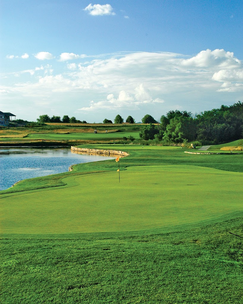 Panoramic view of a lush green golf course at Falcon Lakes Golf Club. Smooth