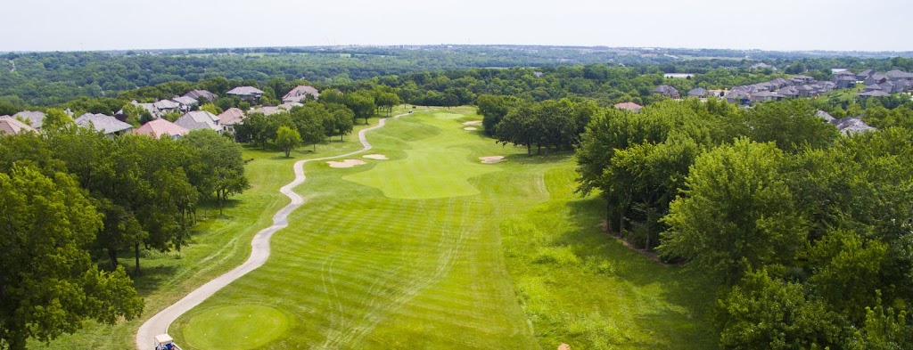 Panoramic view of a lush green golf course at Falcon Ridge Golf Club. Smooth