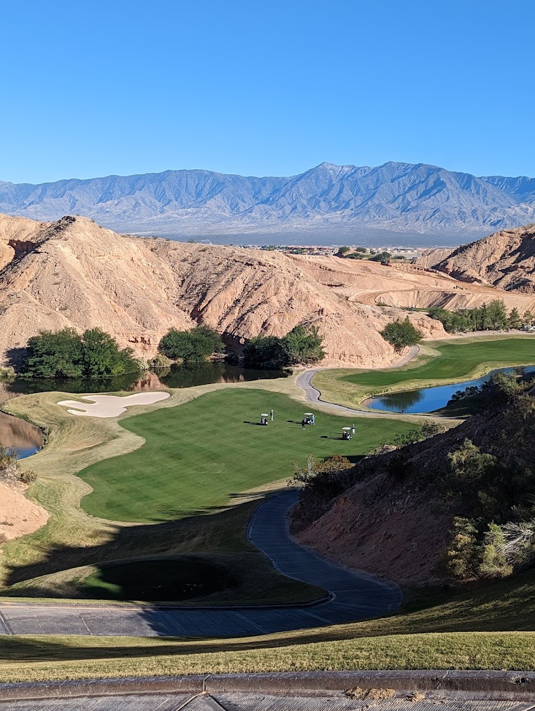 Panoramic view of a lush green golf course at Falcon Ridge Golf Course. Smooth