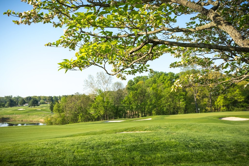 Panoramic view of a lush green golf course at Falls Road Golf Course. Smooth