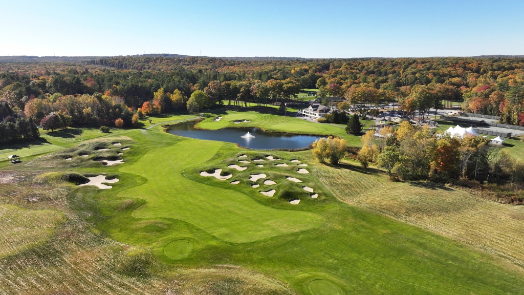 Panoramic view of a lush green golf course at Falmouth Country Club. Smooth