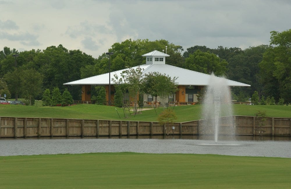 Panoramic view of a lush green golf course at Farm d' Allie Golf Club. Smooth