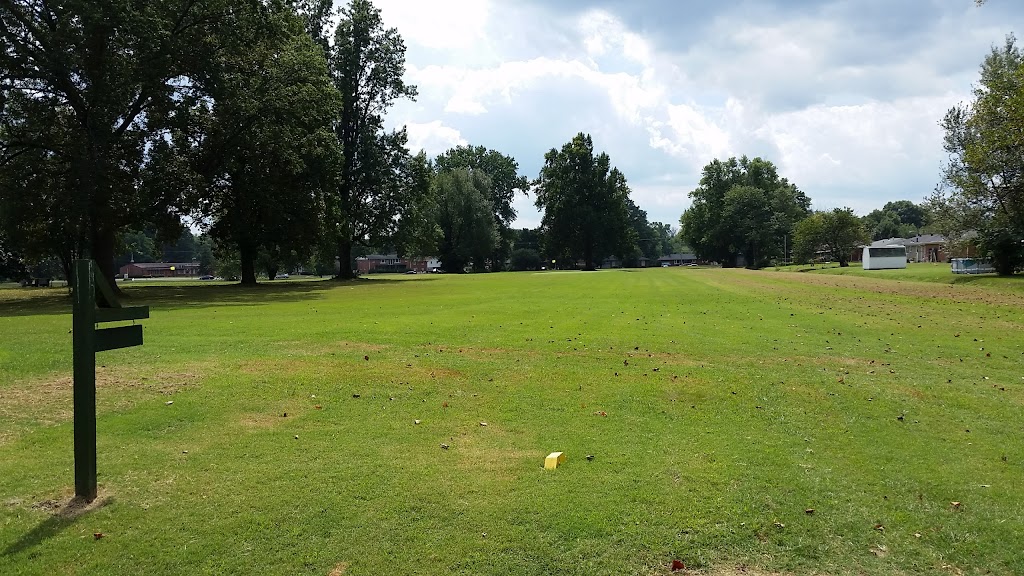 Panoramic view of a lush green golf course at Farnsley Golf Center. Smooth