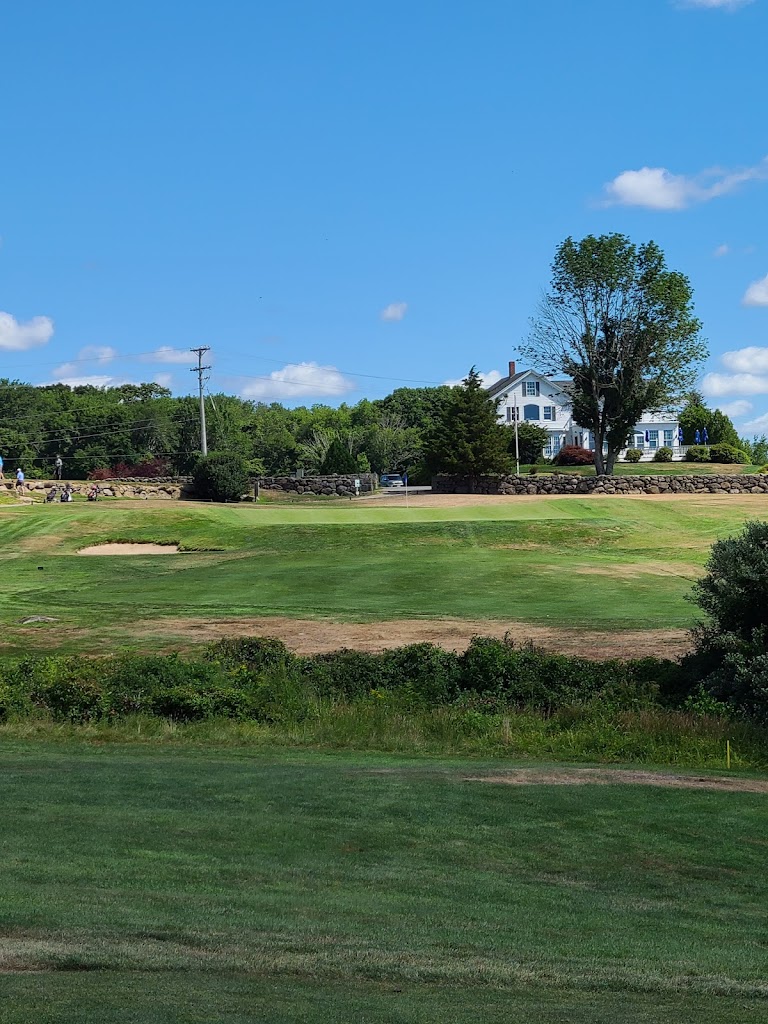 Panoramic view of a lush green golf course at Fenner Hill Country Club. Smooth