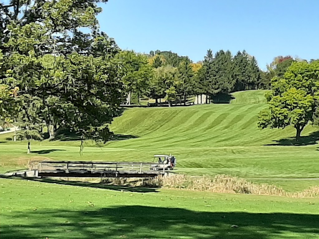 Panoramic view of a lush green golf course at Fillmore Fairways Golf Course. Smooth