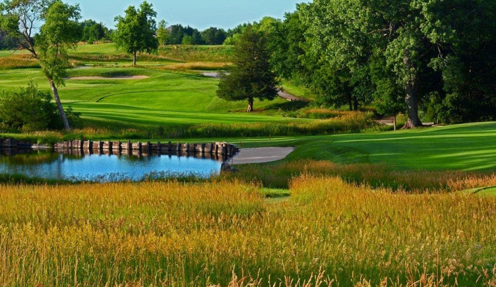 Panoramic view of a lush green golf course at Firethorn Golf Club. Smooth