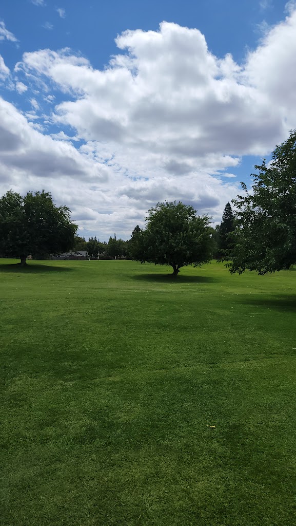 Panoramic view of a lush green golf course at Foothill Golf Course. Smooth