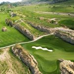 Panoramic view of a lush green golf course at Fossil Trace Golf Club. Smooth